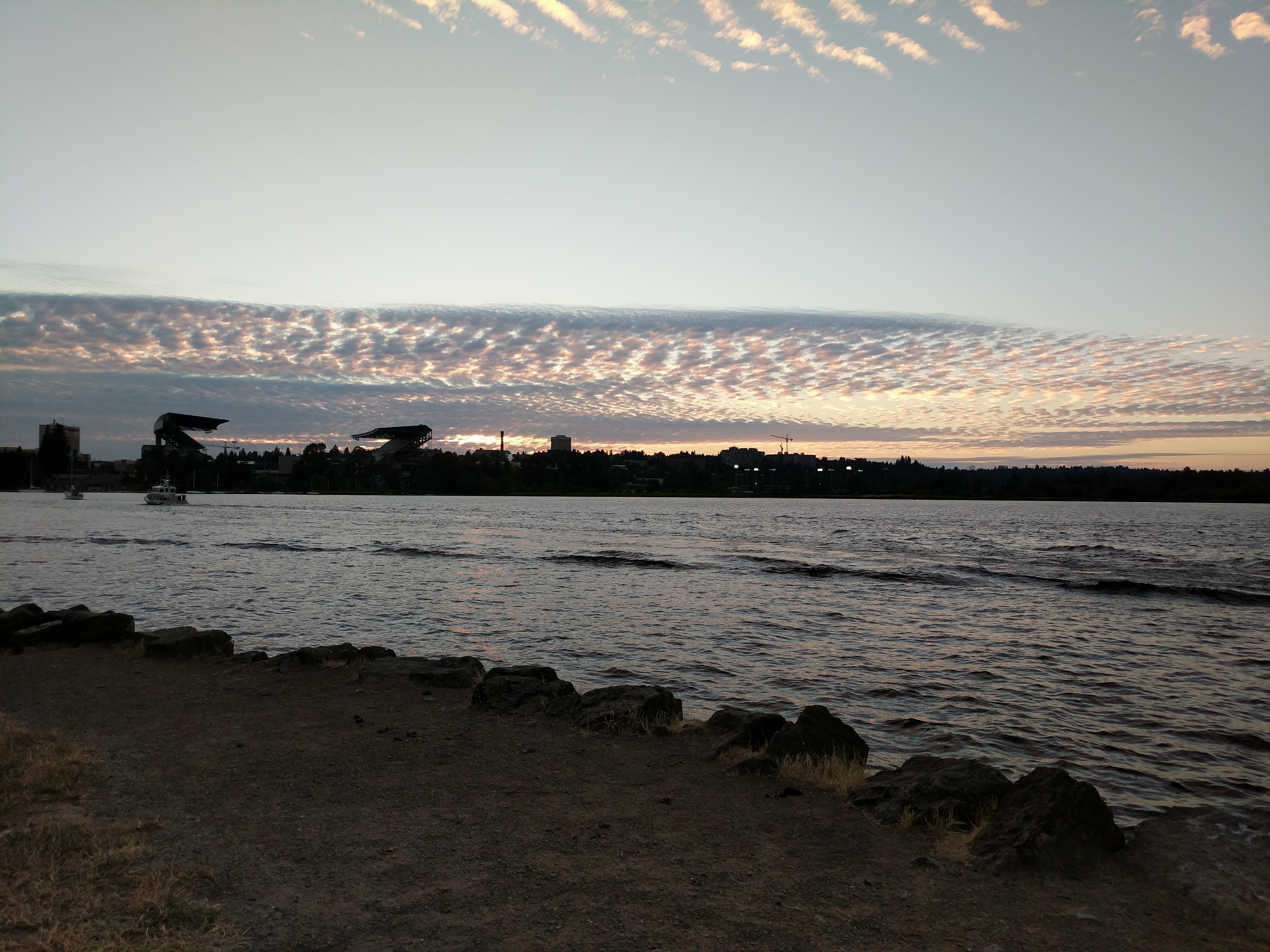 Seattle waterfront at sunset with patterned clouds